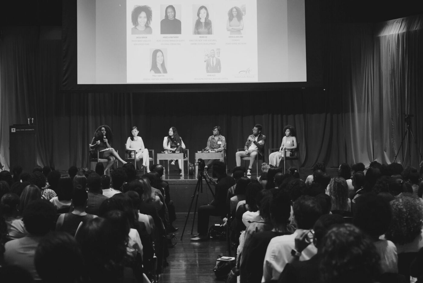 Panel discussion on stage at a PHXMF event
